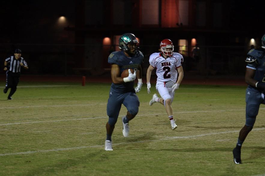 Cloves Campbell runs with the ball on his way to a 98-yard interception return. Courtesy of Nicholas Tirella