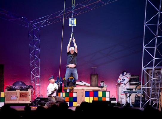 Adam Savage hangs from two ordinary interwoven phone books as Jamie Hyneman hoists him skyward. The experiment shows how strong the use of friction between objects is.