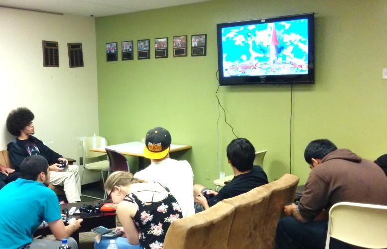 A group of SCC students relieve stress after classes by playing video games.