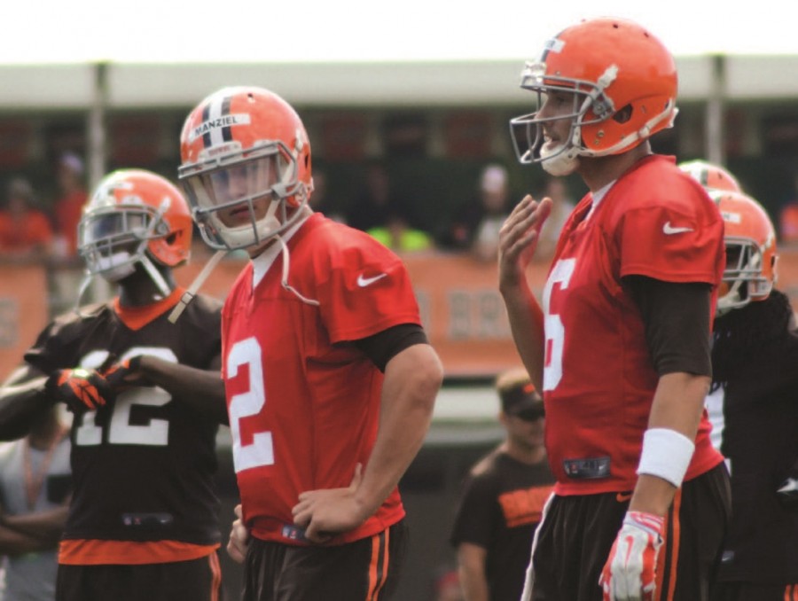 Johnny Manziel (center) looks on during a 2014 practice session with  the Cleveland Browns. The Browns released Manziel in March and he is as yet unsigned.
