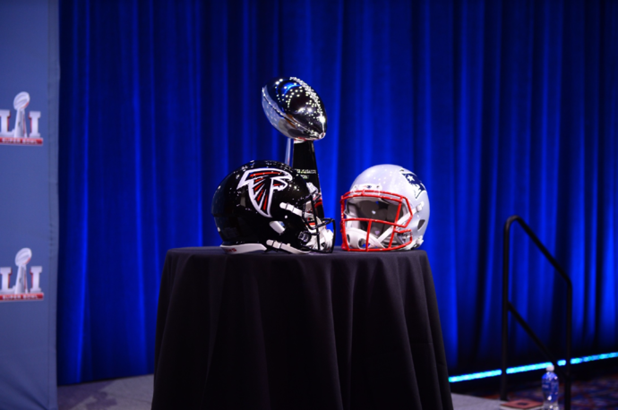 The New England Patriots (helmet pictured right) won the Vince Lombardi Trophy (middle) against the Atlanta Falcons (helmet pictured left) after a 25-point comeback and first-ever Super Bowl overtime session.