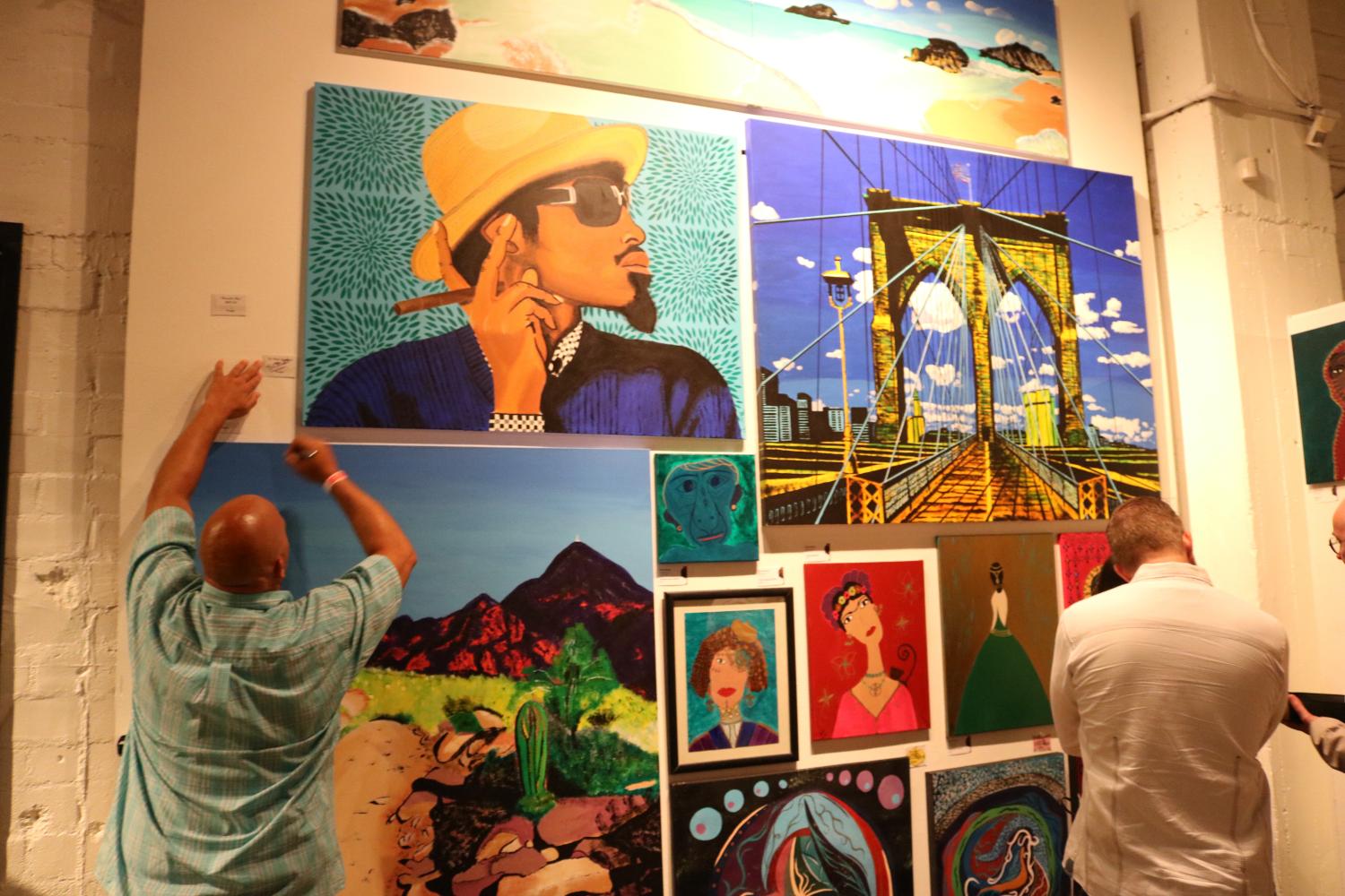 Artwork on display at the Chocolate and Art Show on Sept. 14. The painting top left is the Andre 3000 that was sold later in the show.