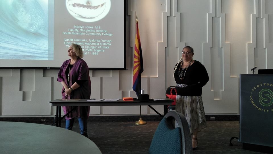 Marilyn Torres (right hand side, wearing black top) giving a PowerPoint presentation on storytelling.