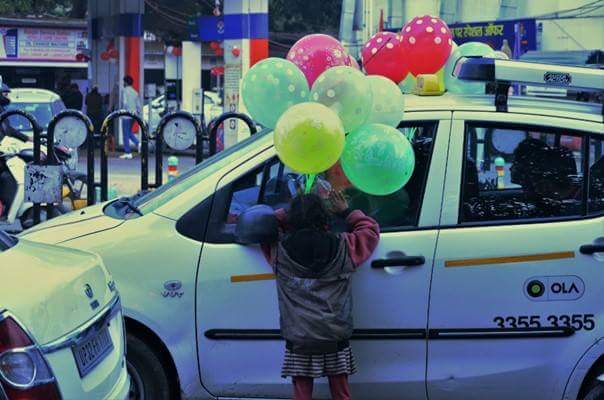 Hazratganj Market, Lucknow. Children under the age of 14 are selling balloons which is not legal, because according to law its child labor.