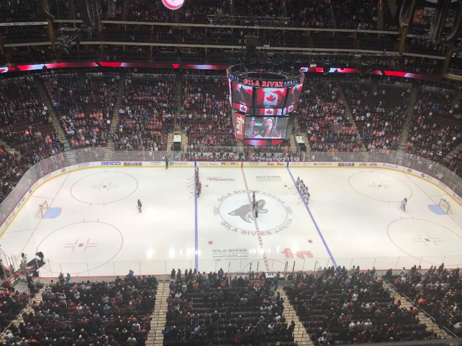 The Coyotes and The Oilers standing for the Canadian National Anthem