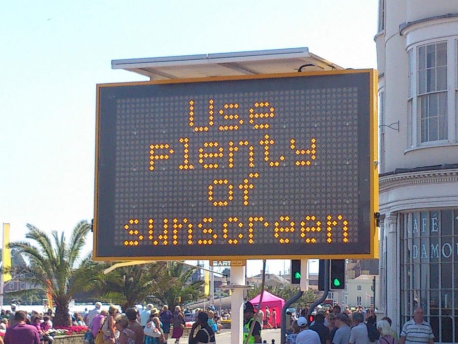  A sign encouraging sunscreen use at beginning of a summer holiday