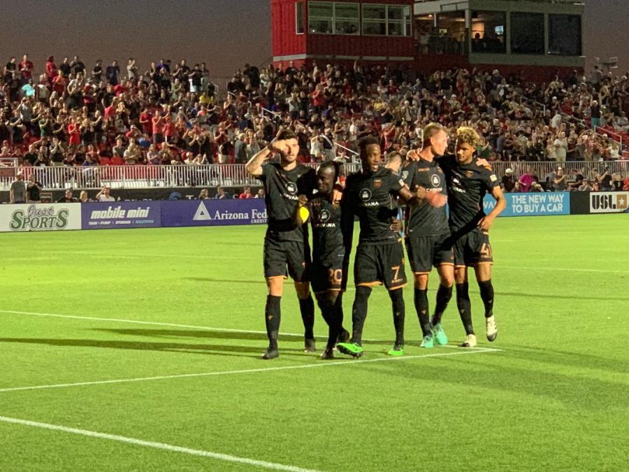 Solomon Asante with his teammates in Rising celebration 