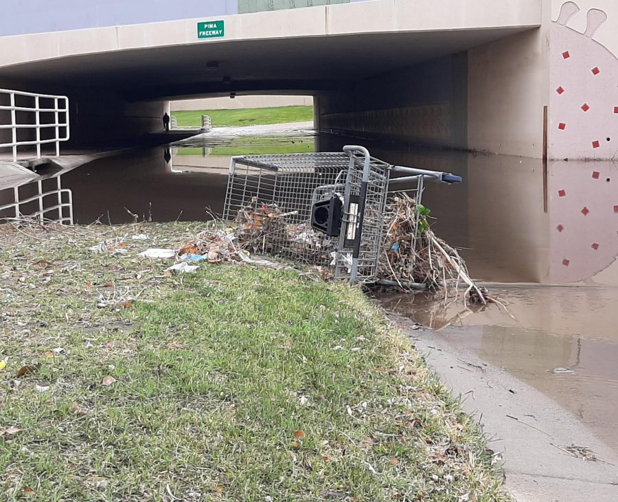 Heavy rains caused a shopping cart and other debris to wash out of little used drainage canals in the Scottsdale area