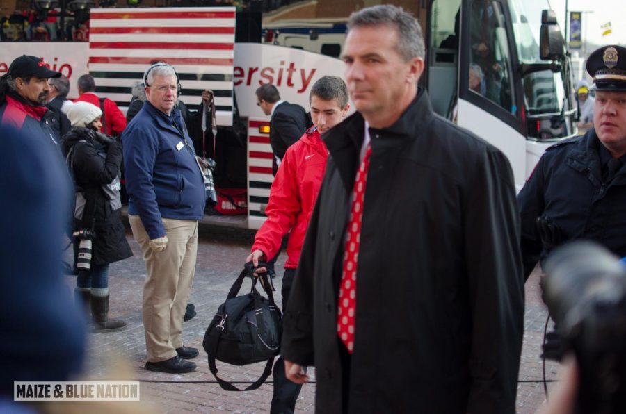 Urban Meyer draws some suspicious looks on the campus of arch rival Michigan in 2013