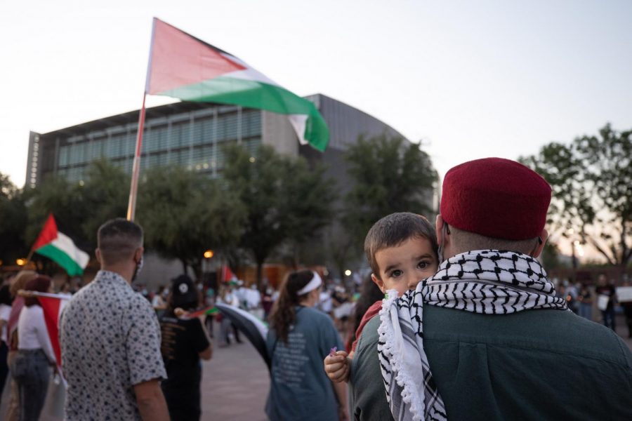 Palestine supporter listening to speakers 