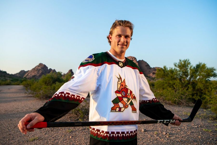 Coyotes defenseman Jakob Chychrun models the new jersey.