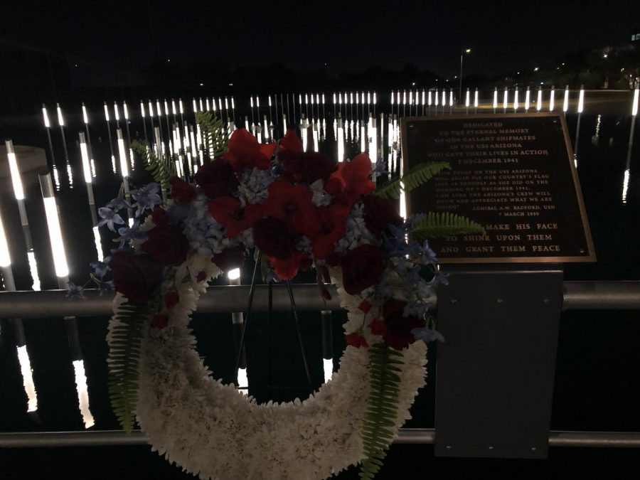 A+wreath+placed+at+the+front+of+the+area+that+represents+the+exact+length+and+width+of+the+USS+Arizona.