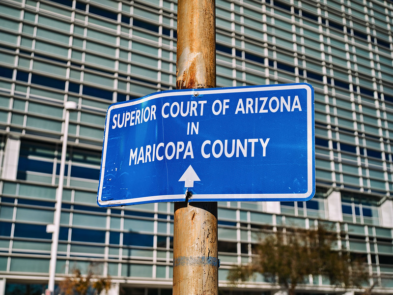 A sign in downtown Phoenix pointing to the Superior Court of Arizona in Maricopa County.