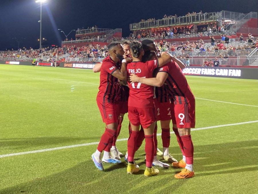 Rising FC players celebrate one of their six goals on Saturday night against Memphis FC.
