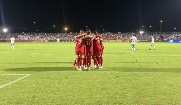 Rising celebrate after one of five goals against Detroit City