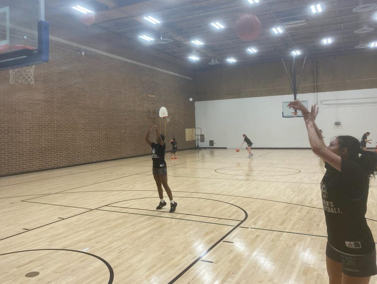 members of the Scottsdale womens basketball team warm up before practice