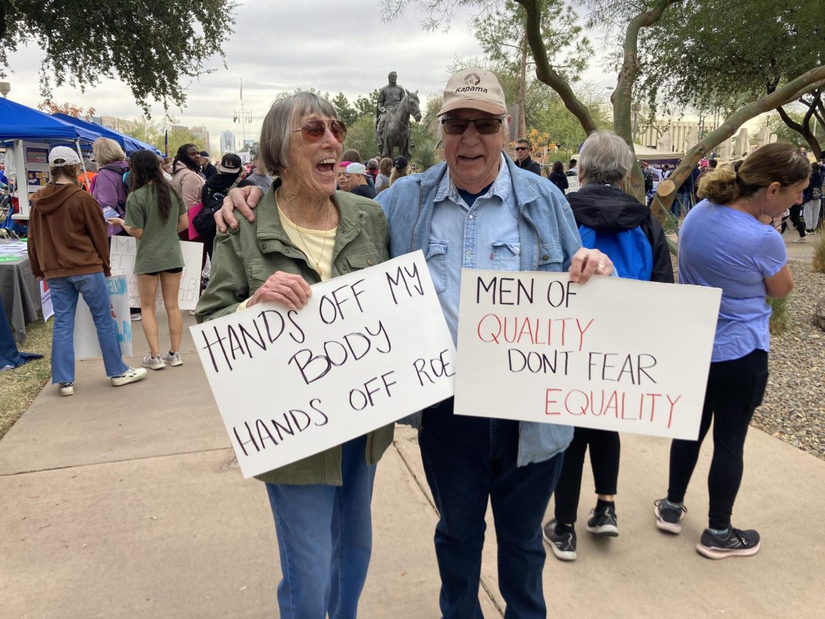 Ellen Judd (left) and Brian Judd (right), both in their nineties, express pride in marching and showing their support at the National Womens March.